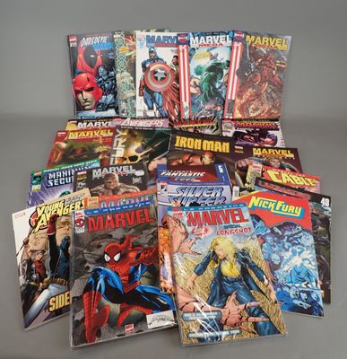 a pile of comics sitting on top of a table next to each other