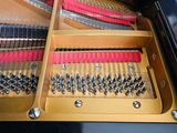 a close up of a piano with a person playing it