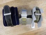two watches that are sitting on a wooden table