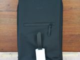 a black backpack with a charger attached to it