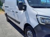 the white van is parked on the side of the road