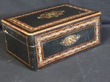 a black and gold box sitting on a black background