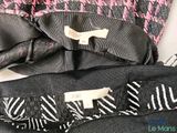 a close up of a dress with a bow tie on it