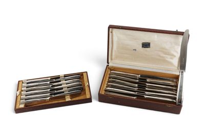 pair of silver plated knives in a wooden box on a white background