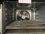 a picture of a microwave that has a lot of food inside of it