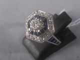 an image of a diamond and sapphire ring
