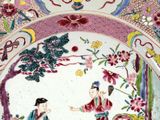 a plate with a picture of a woman and a man on it
