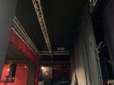 a stage with a red curtain and a stage with a red curtain and a stage with a red curtain and a stage with a red curtain and white curtain