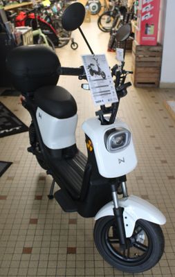 a motor scooter that is parked in a store