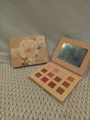 an image of a picture of a makeup palette and a picture of a flower