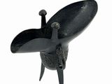 a black sculpture of a bird on a white background