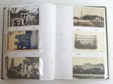 an open book with pictures of buildings and a bridge