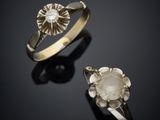 un gros plan sur deux bagues et une bague ornée d'une fleur