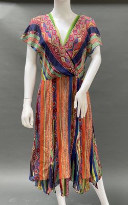 a mannequin wearing a multicolored dress on a mannequin