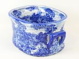 a blue and white cup with a handle on it