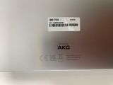 the back of a silver laptop with a barcode on it