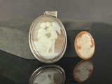 an image of a couple of cameos sitting on top of a table