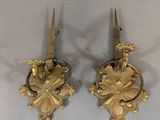 pair of antique brass wall sconces in the shape of a bird