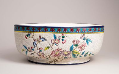 a white bowl with blue and red designs on it