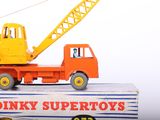 a toy truck with a crane on top of it
