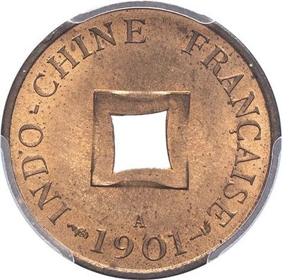 a close up of a coin with a hole in the middle