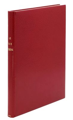 un livre à couverture rigide rouge avec des lettres dorées sur la couverture