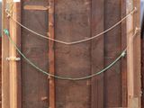 a picture of a wooden frame with a rope on it