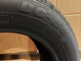 a close up of a tire on a cardboard box next to a cardboard box