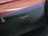 the inside of a chanel bag with a zipper on it