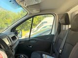 the interior of a car with black seats and a steering wheel