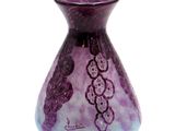 a purple vase with a pattern on it on a white background