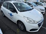 a white car parked in a parking lot with other cars
