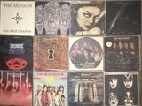 the album covers of the first chapter of the mission are displayed on a wall