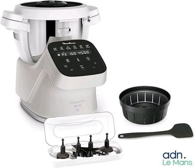 an image of a blender with a bowl and spoon