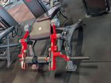 a gym room with a row of exercise equipment