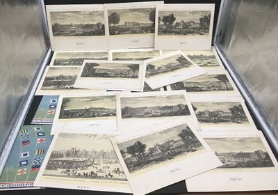 beaucoup de photos dans une valise posée sur la table