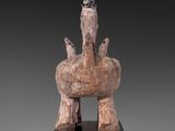 an image of a statue of a horse on a wooden base