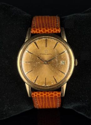 an image of a wrist watch with a brown leather band