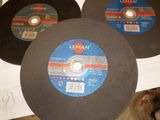 three grinding discs are sitting on a table next to each other