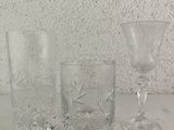 three glasses sitting on a table next to each other