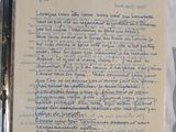 a piece of paper with writing on it next to a pair of scissors