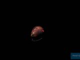 an apple in the dark with a black background