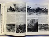 an open book with a picture of a plane in it