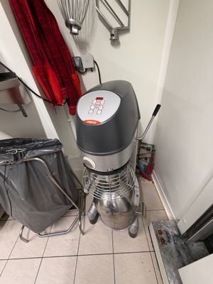 an image of a kitchen with a mixer on the floor