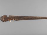an image of a wooden knife on a white surface