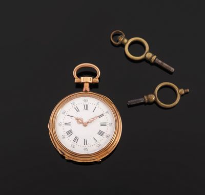 an image of a pocket watch with a key on a black surface