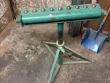 a green table that has a bunch of tools on it