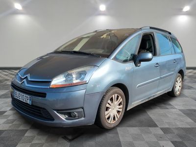 a picture of a blue citrole parked in a showroom