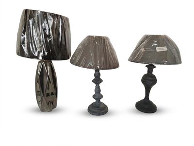three lamps that are sitting next to each other on a table