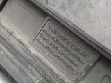 a close up of a car ' s bumper with a plaque on it